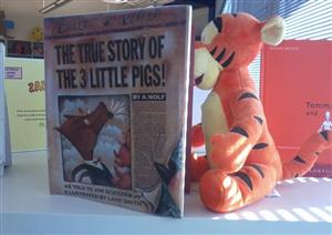 Tiger reading a book. 